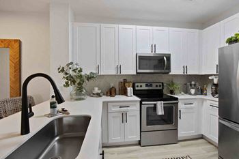 Newly-designed shaker kitchen cabinets with matte black hardware